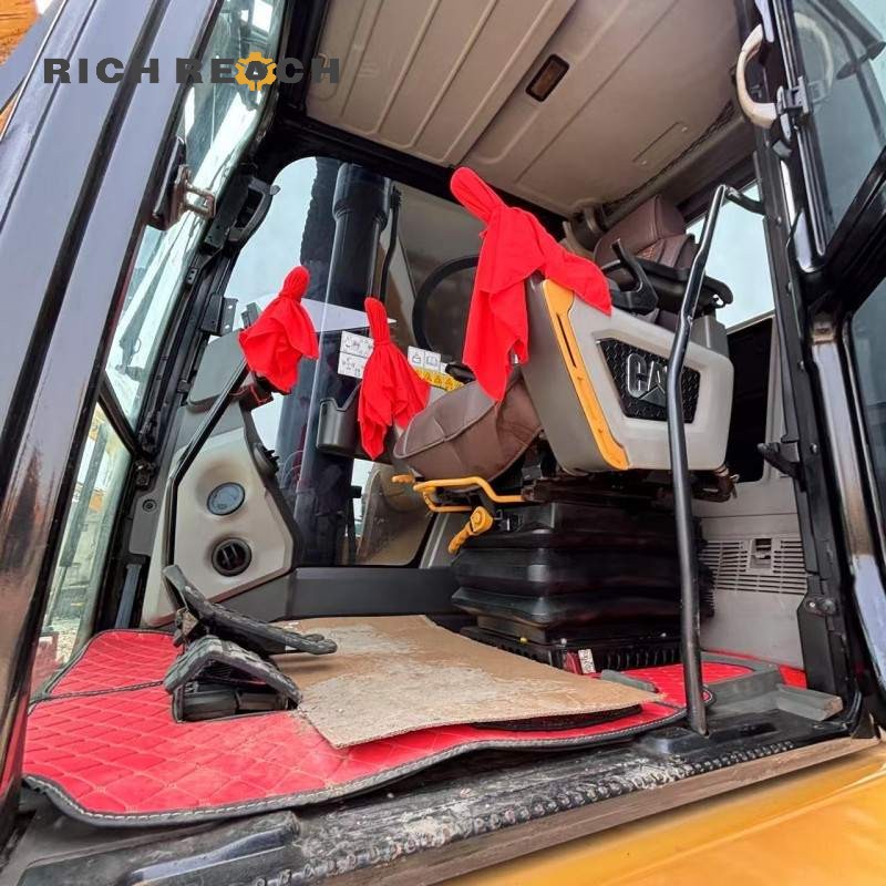 Close-up of cab interior and controls in a 2021 Cat 330GC excavator, $79,167 for sale